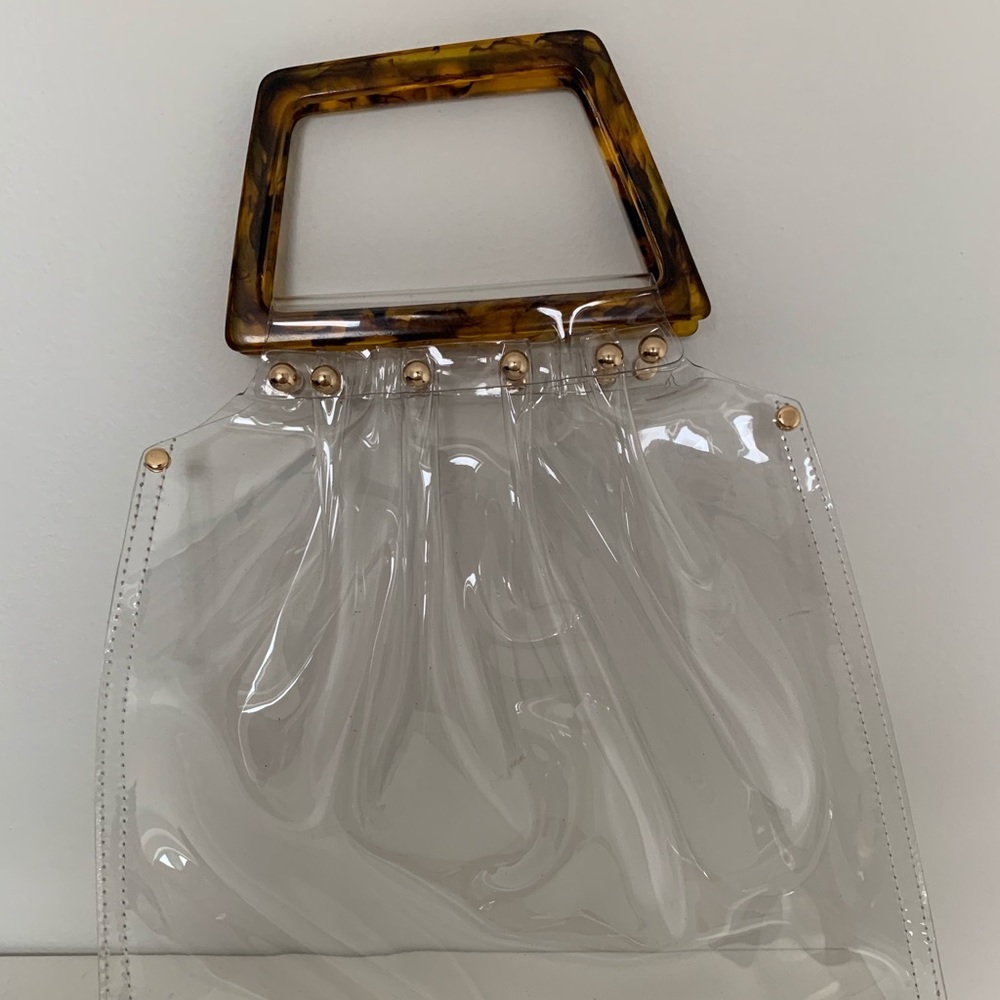 Clear bag with tortoise handle